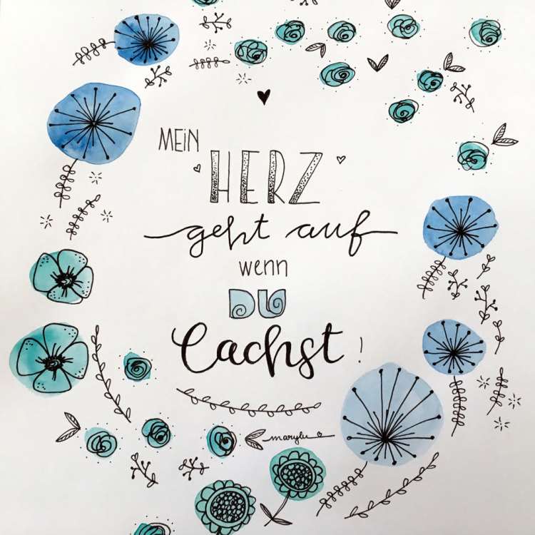 Handlettering mit Blumen in einem Kranz drumherum - mein Herz geht auf wenn du lachst